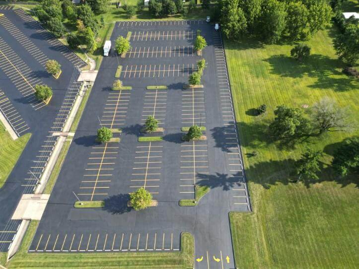 A parking lot with yellow parking spots.