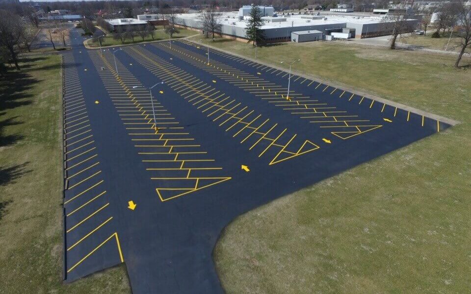 A parking lot with yellow spaces.