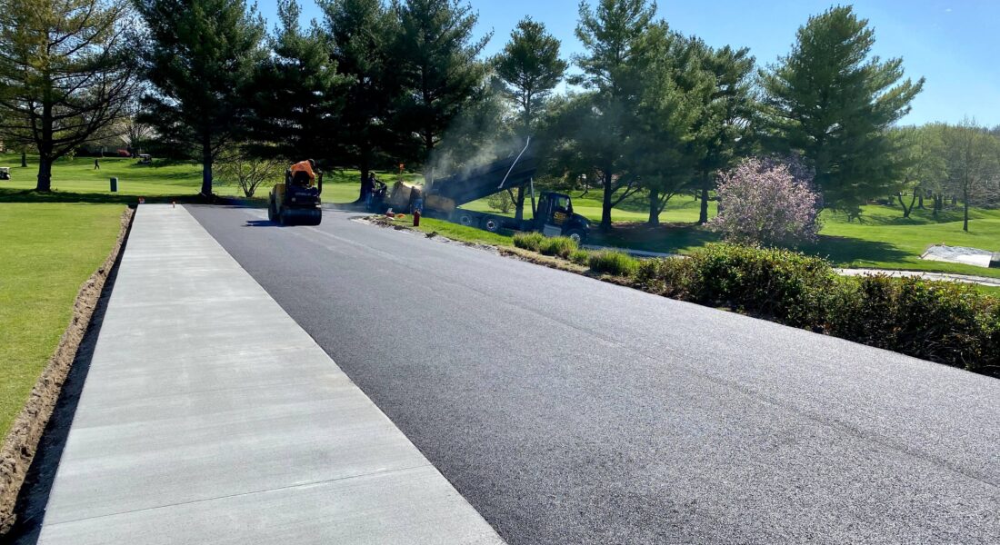 A freshly paved road on a golf course.