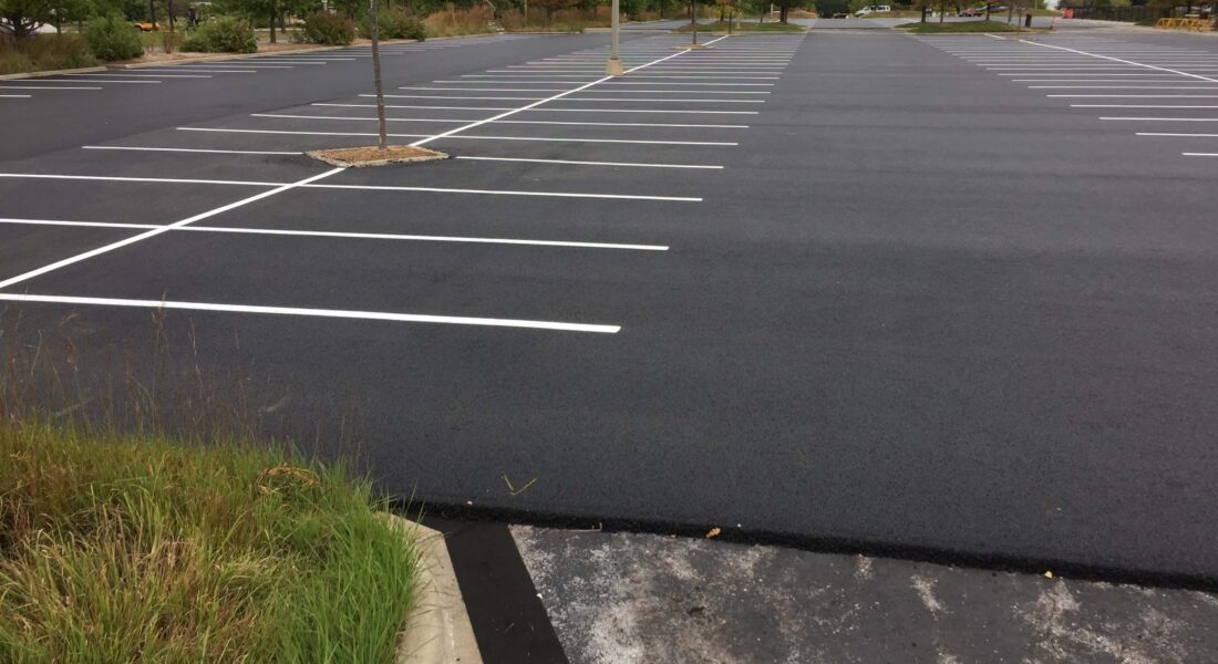 A newly paved and striped parking lot.
