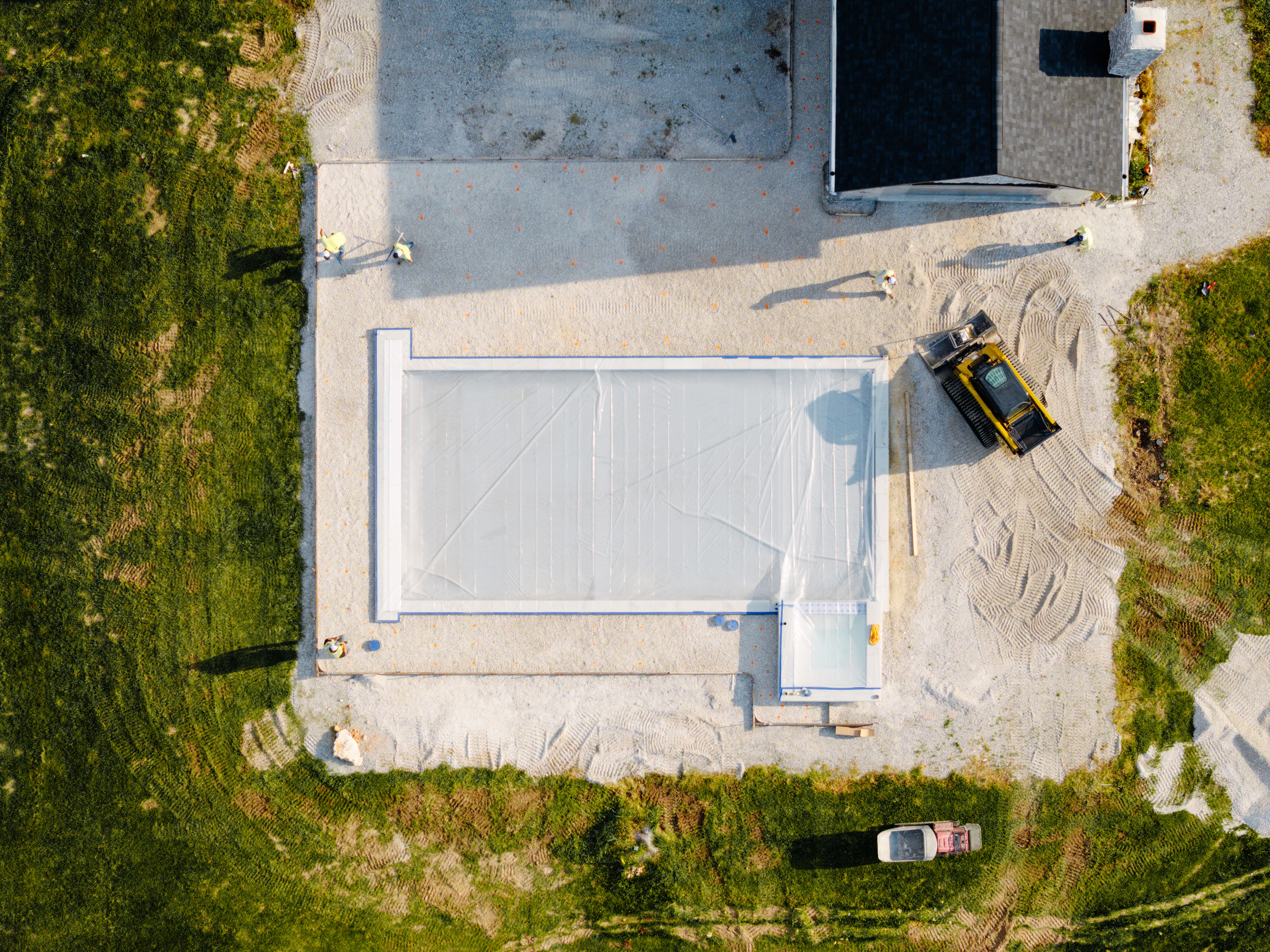 Overhead shot of concrete work around a pool.