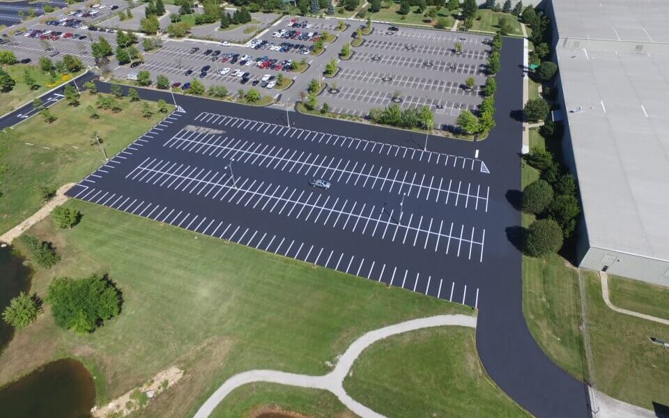 A parking lot painted with white parking spots.