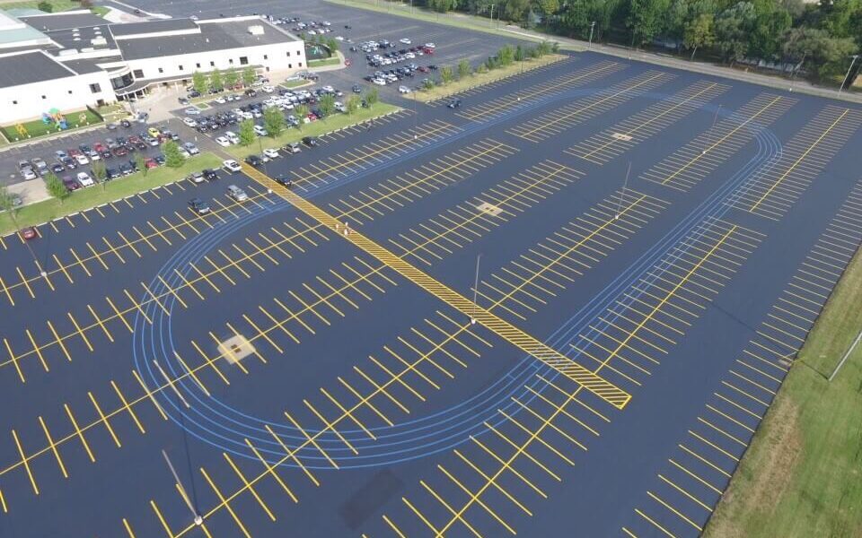 An overhead drone shot of a fully striped and finished parking lot.