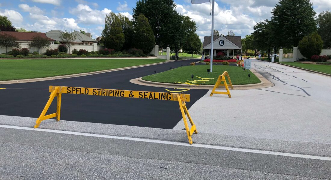 SPFD Striping & Sealing barrier in front of an in progress drive being resurfaced.