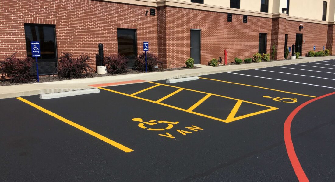 Freshly paved and striped accessible parking spots.