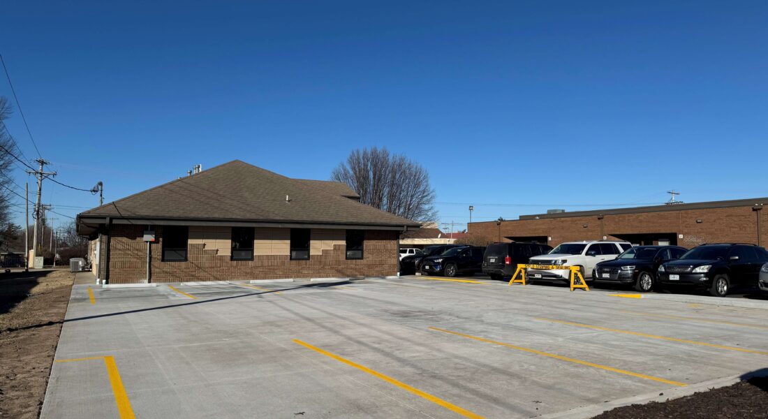 A newly striped parking lot with yellow lines.